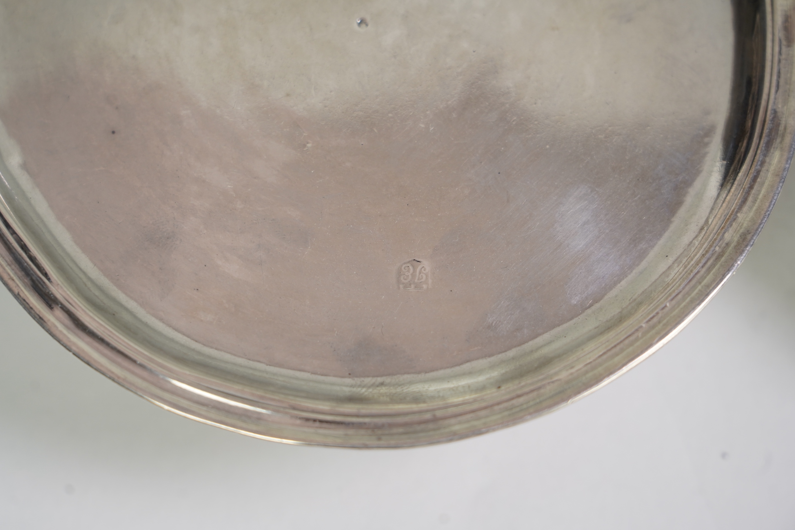 A pair of early late George I/early George II provincial silver patens, by John Elston Jnr